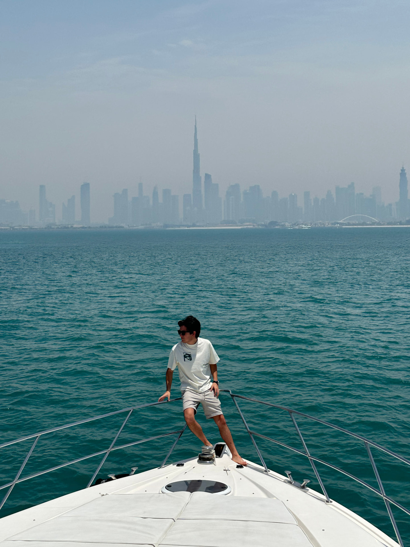 Daniel Rojas on a yacht with the Dubai skyline behind him